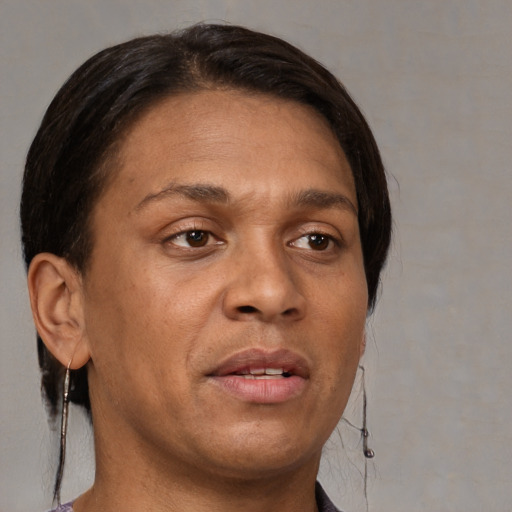Joyful white adult female with short  brown hair and brown eyes