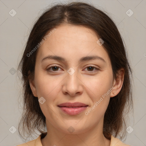 Joyful white young-adult female with medium  brown hair and brown eyes