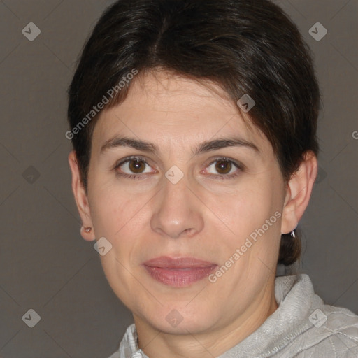 Joyful white adult female with short  brown hair and brown eyes