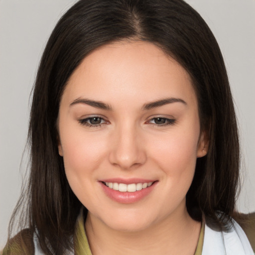 Joyful white young-adult female with medium  brown hair and brown eyes