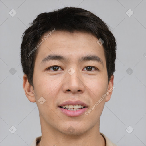 Joyful asian young-adult male with short  brown hair and brown eyes