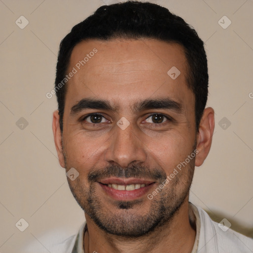 Joyful white young-adult male with short  black hair and brown eyes