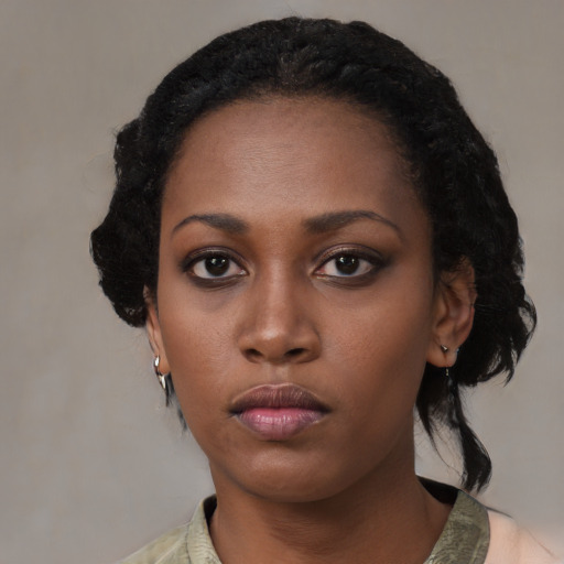 Neutral black young-adult female with medium  black hair and brown eyes