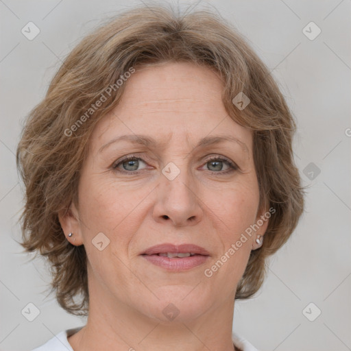 Joyful white adult female with medium  brown hair and grey eyes