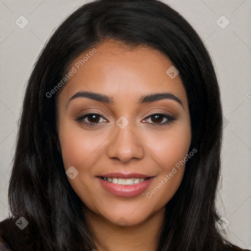 Joyful latino young-adult female with long  black hair and brown eyes