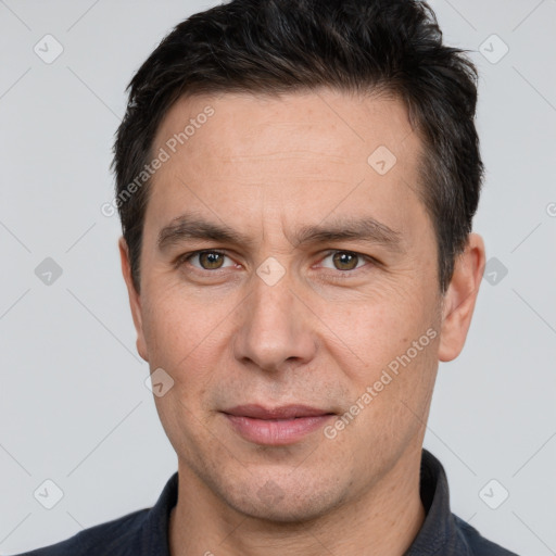 Joyful white adult male with short  brown hair and brown eyes