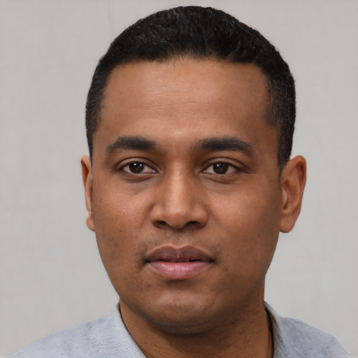 Neutral black young-adult male with short  black hair and brown eyes
