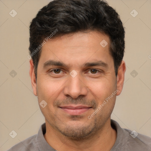 Joyful white adult male with short  black hair and brown eyes