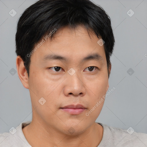 Neutral asian young-adult male with short  brown hair and brown eyes