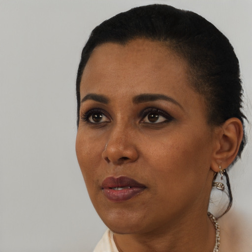 Neutral black young-adult female with short  black hair and brown eyes
