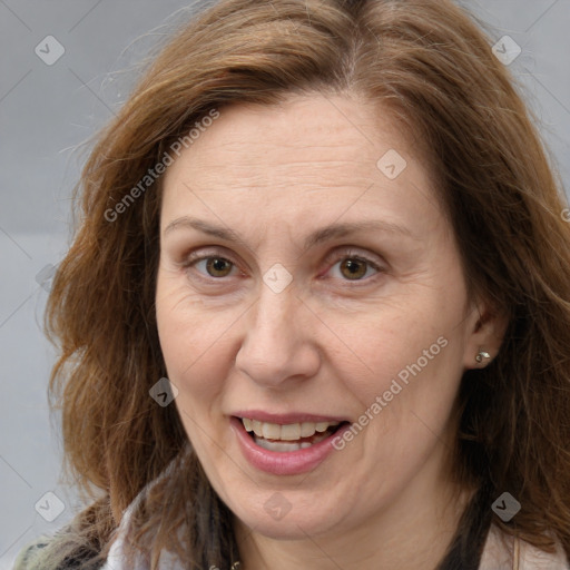 Joyful white adult female with long  brown hair and brown eyes