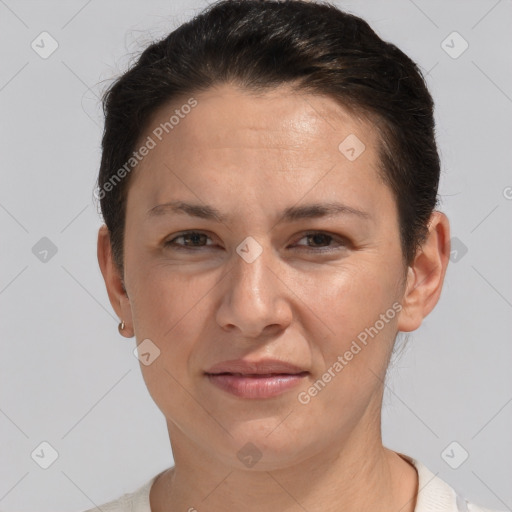 Joyful white adult female with short  brown hair and brown eyes