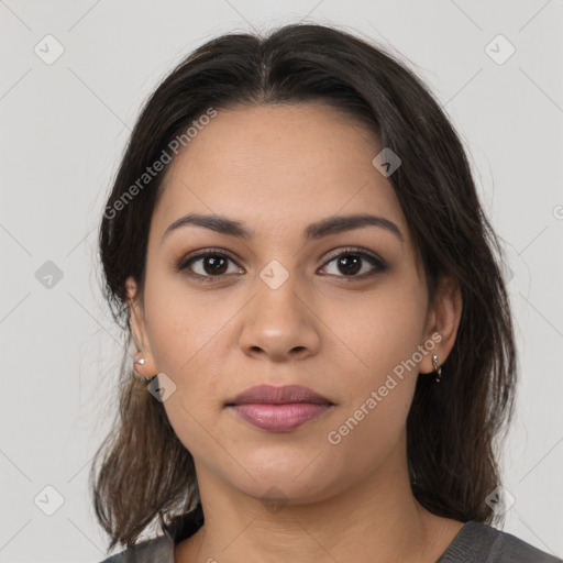 Joyful latino young-adult female with medium  brown hair and brown eyes