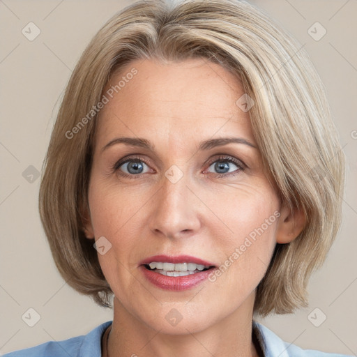 Joyful white adult female with medium  brown hair and blue eyes