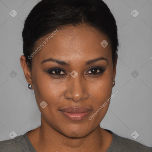 Joyful black young-adult female with short  black hair and brown eyes