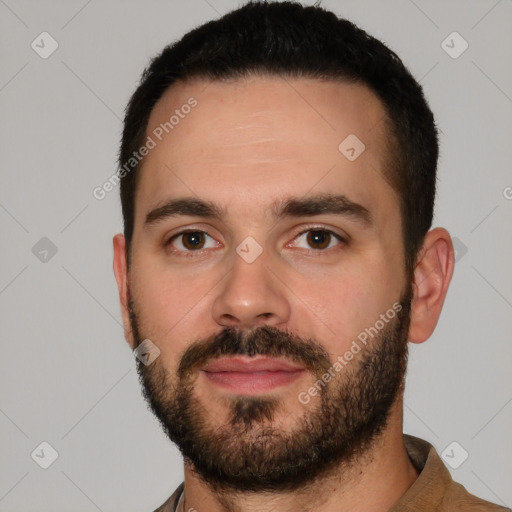 Neutral white young-adult male with short  black hair and brown eyes