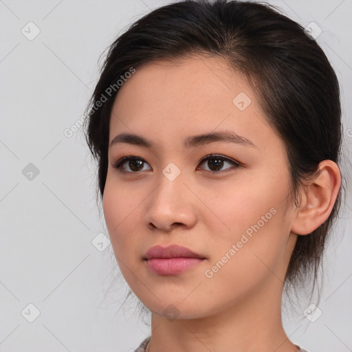 Neutral asian young-adult female with medium  brown hair and brown eyes