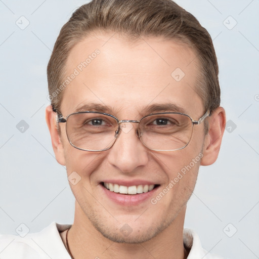 Joyful white adult male with short  brown hair and grey eyes