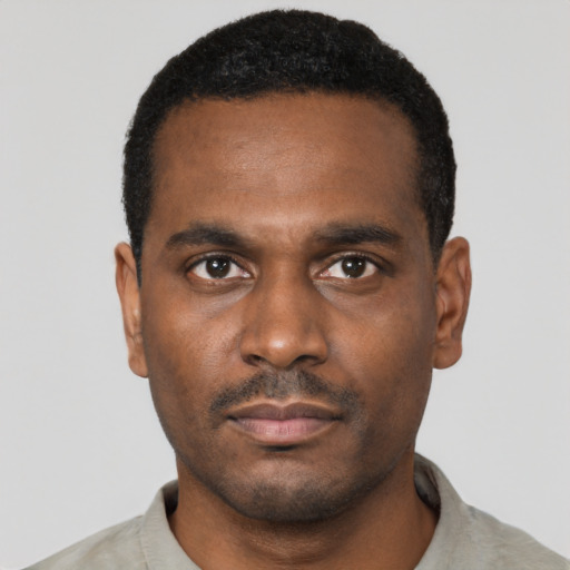 Neutral black young-adult male with short  black hair and brown eyes