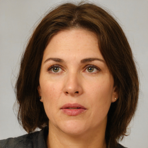 Neutral white adult female with medium  brown hair and brown eyes