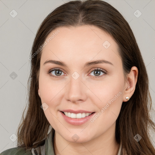 Joyful white young-adult female with long  brown hair and grey eyes