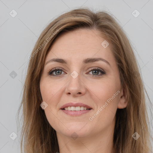 Joyful white adult female with long  brown hair and brown eyes