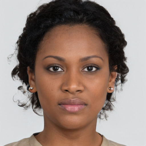Neutral black young-adult female with medium  black hair and brown eyes