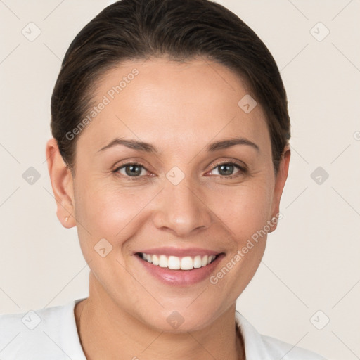 Joyful white young-adult female with short  brown hair and brown eyes