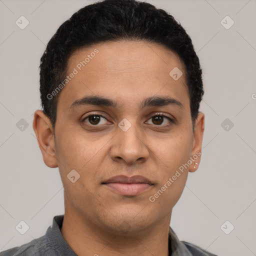 Joyful latino young-adult male with short  black hair and brown eyes