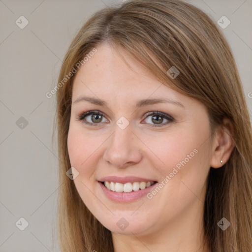 Joyful white young-adult female with long  brown hair and brown eyes