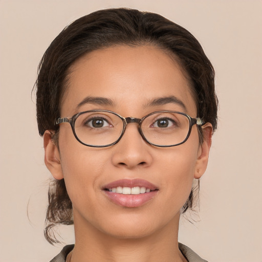 Joyful white young-adult female with medium  brown hair and brown eyes