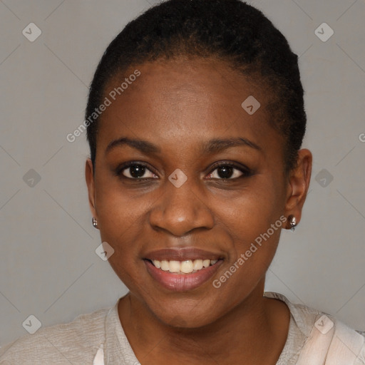 Joyful black young-adult female with short  brown hair and brown eyes