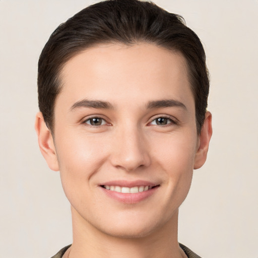 Joyful white young-adult female with short  brown hair and brown eyes