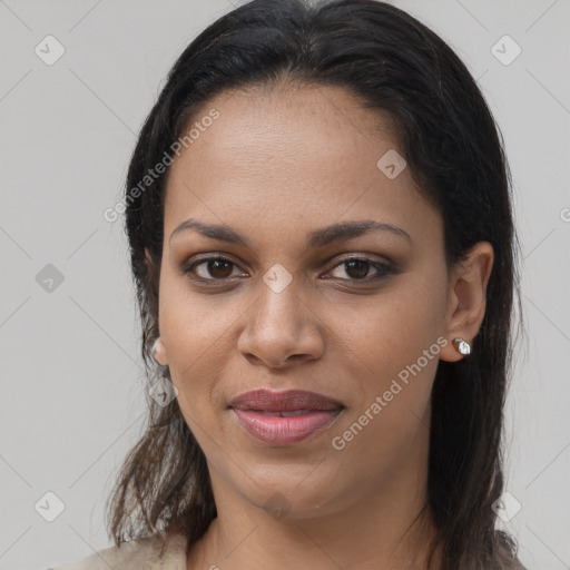 Joyful latino young-adult female with long  brown hair and brown eyes