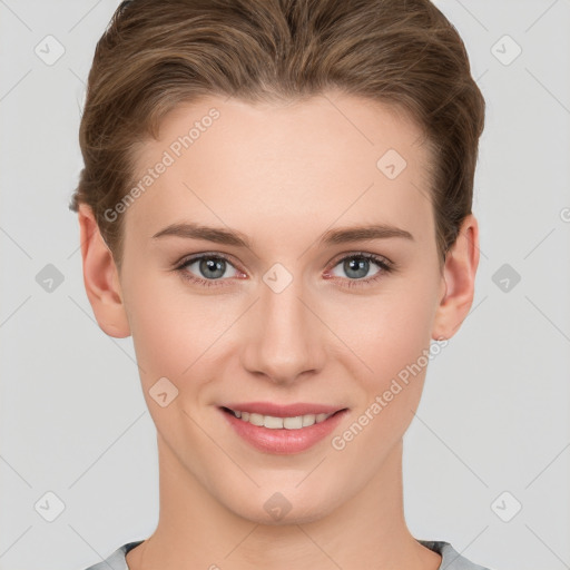 Joyful white young-adult female with short  brown hair and grey eyes