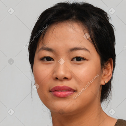 Joyful asian young-adult female with medium  black hair and brown eyes