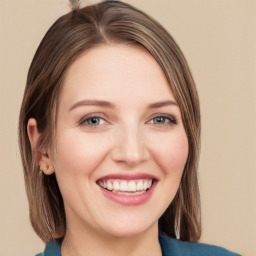 Joyful white young-adult female with medium  brown hair and blue eyes