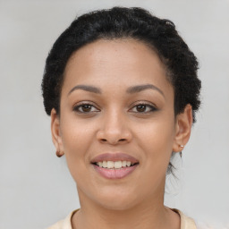 Joyful latino young-adult female with short  black hair and brown eyes