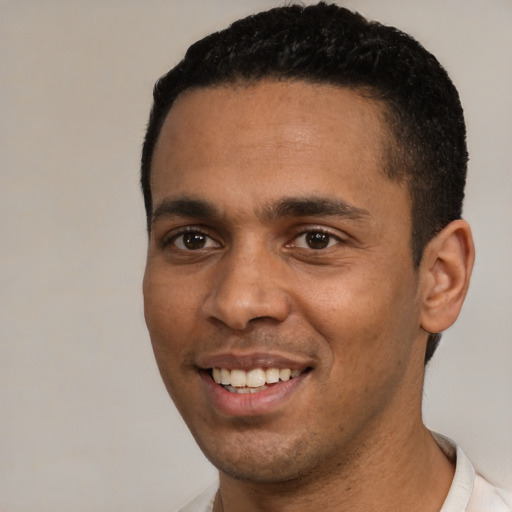 Joyful white young-adult male with short  black hair and brown eyes