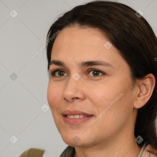 Joyful white young-adult female with medium  brown hair and brown eyes