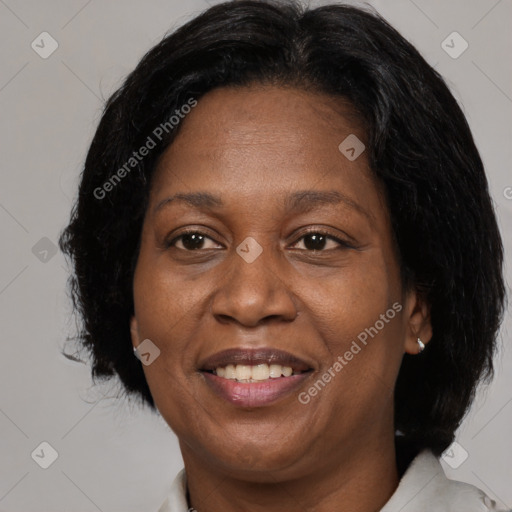 Joyful black adult female with medium  brown hair and brown eyes