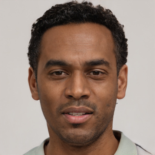 Neutral black young-adult male with short  black hair and brown eyes