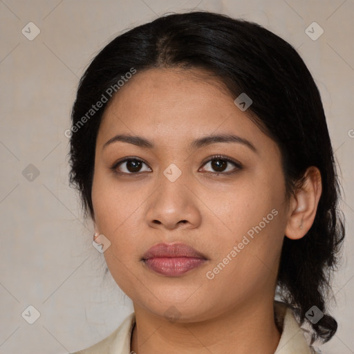 Joyful latino young-adult female with medium  brown hair and brown eyes