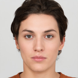 Neutral white young-adult female with short  brown hair and brown eyes