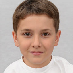 Joyful white child male with short  brown hair and brown eyes