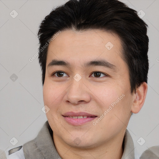 Joyful asian young-adult male with short  brown hair and brown eyes