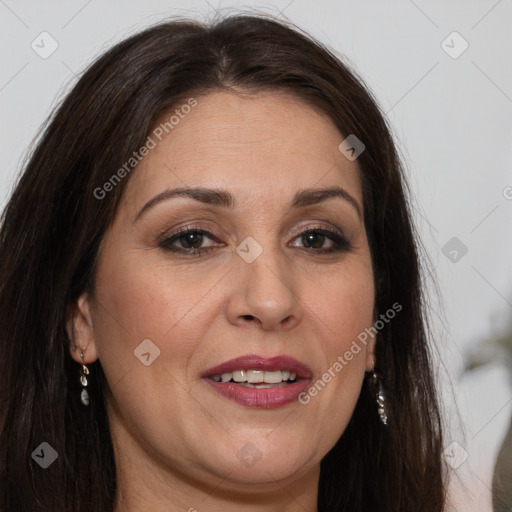 Joyful white adult female with long  brown hair and brown eyes