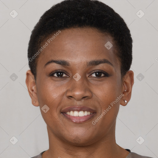 Joyful black young-adult female with short  brown hair and brown eyes