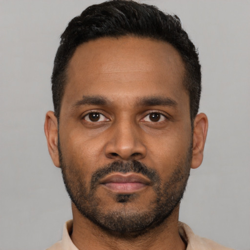 Neutral latino young-adult male with short  black hair and brown eyes