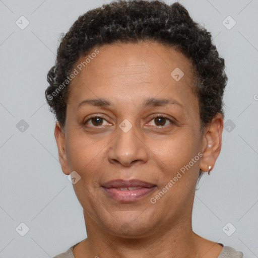 Joyful latino adult female with short  brown hair and brown eyes